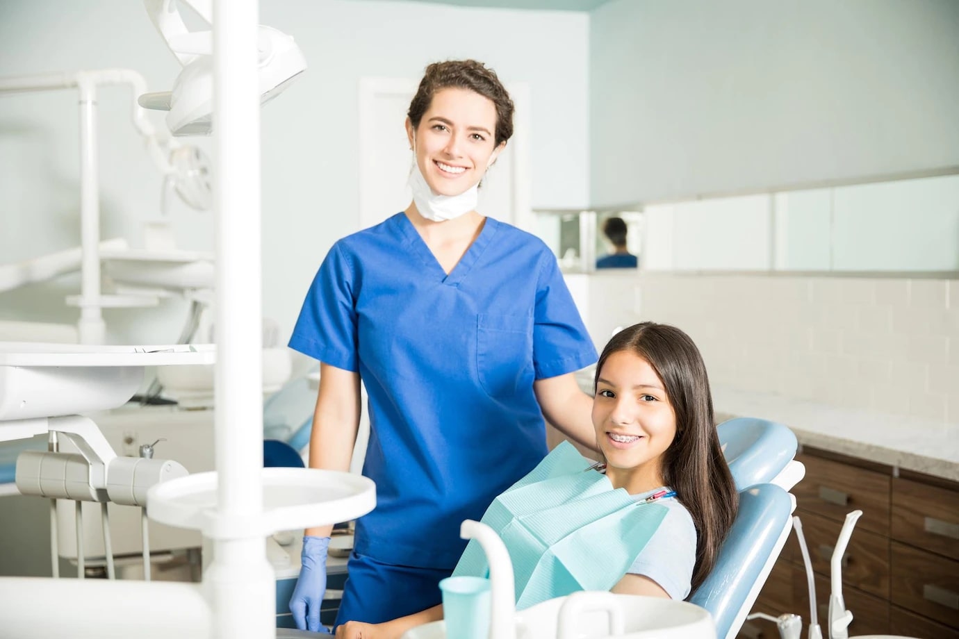 Dental assistant and patient