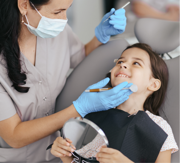 Little girl smiling at the dentist